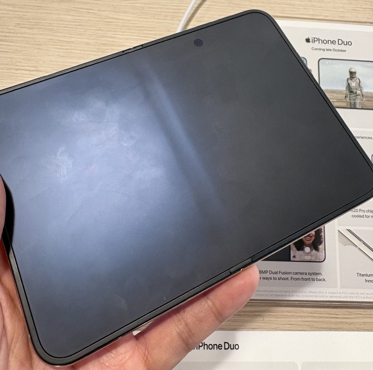 iPhone Duo inner screen turned off, with the crease visible as a light band